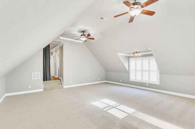This large living space can serve multiple purposes and entertain a large group. | Image 46