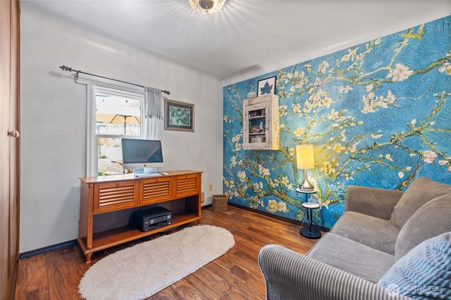 main floor bedroom with accent wall | Image 14