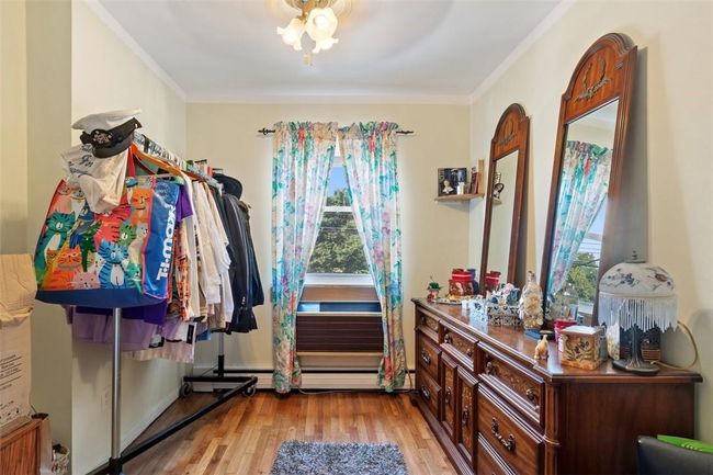 Spacious closet with light hardwood / wood-style flooring | Image 12