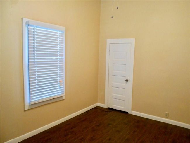 Unfurnished room featuring dark wood finished floors and baseboards | Image 7