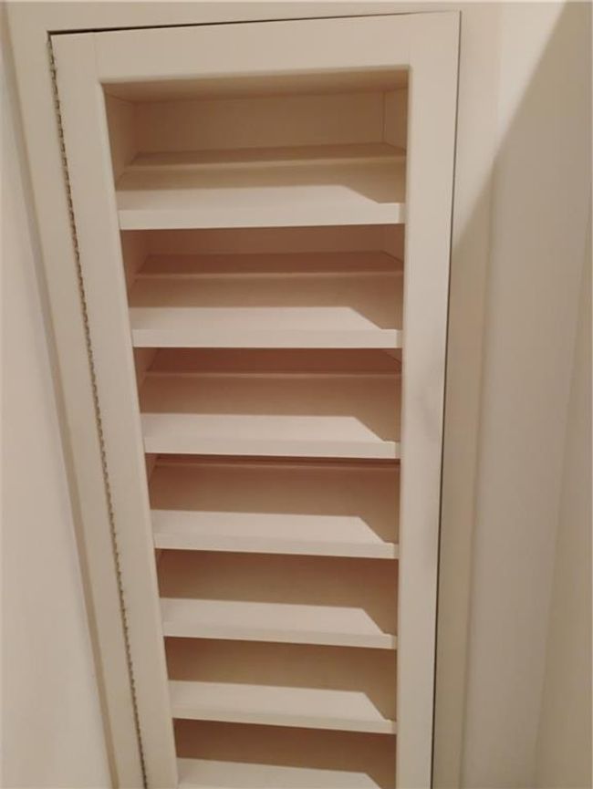 outside shoe rack of secret closet | Image 56
