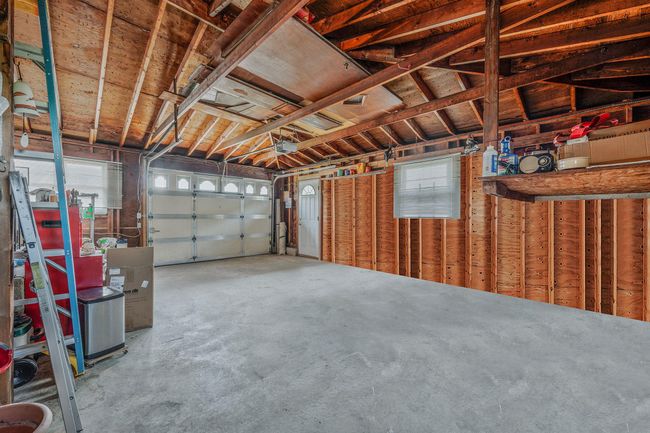 Garage with a garage door opener | Image 24