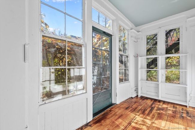 3 season porch with entry to the back yard | Image 11