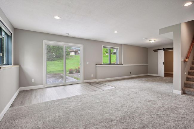The upper level full bath has a paneled accent wall | Image 23