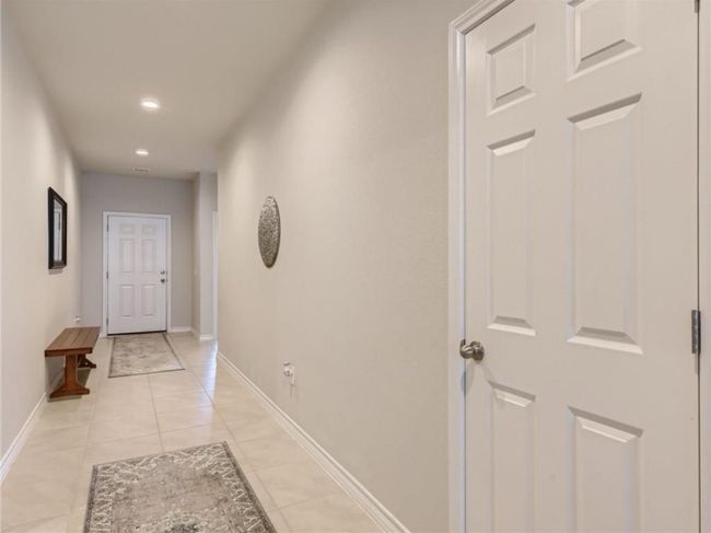 Hall featuring light tile patterned floors and recessed lighting | Image 16