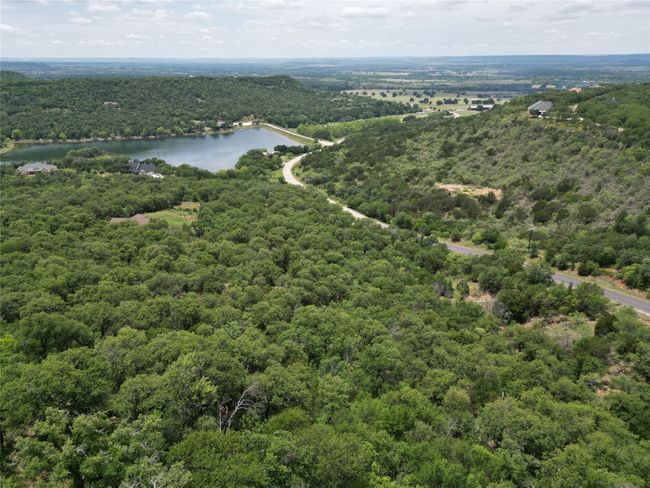 Drone / aerial view with a water view and a view of trees | Image 9
