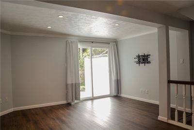 Bright living room with a new door to the deck. | Image 3