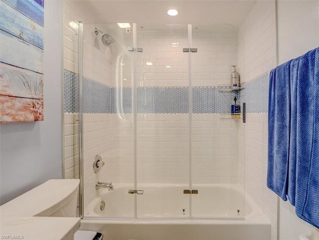 Guest Bathroom with bath / shower combo with glass door and toilet | Image 32