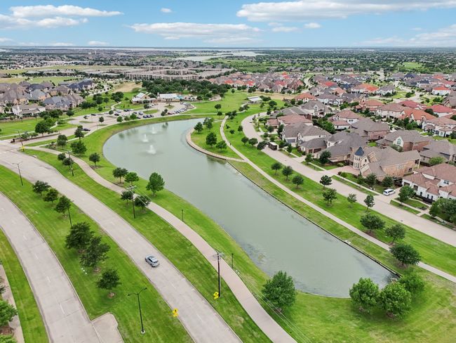 Aerial view of property's location featuring a nearby body of water and nearby suburban area | Image 40