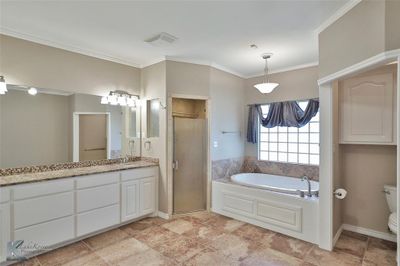 Full bathroom featuring plus walk in shower, toilet, ornamental molding, and vanity | Image 3