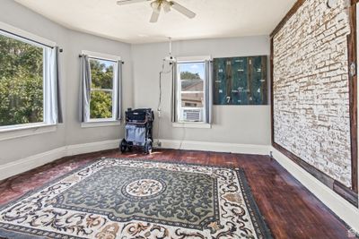 Sitting room featuring ceiling fan, cooling unit, and dark hardwood / wood-style floors | Image 3