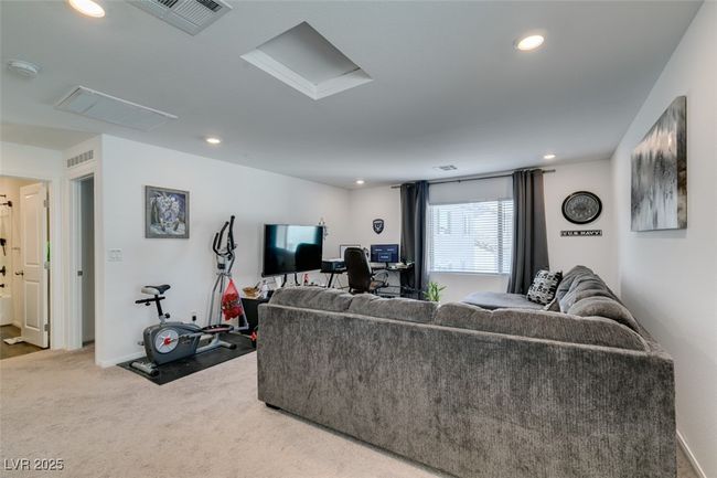 Carpeted living area with recessed lighting and visible vents | Image 32