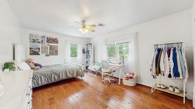 2nd Floor (Very Large) Bedroom with light hardwood flooring, large closet and a ceiling fan. | Image 26