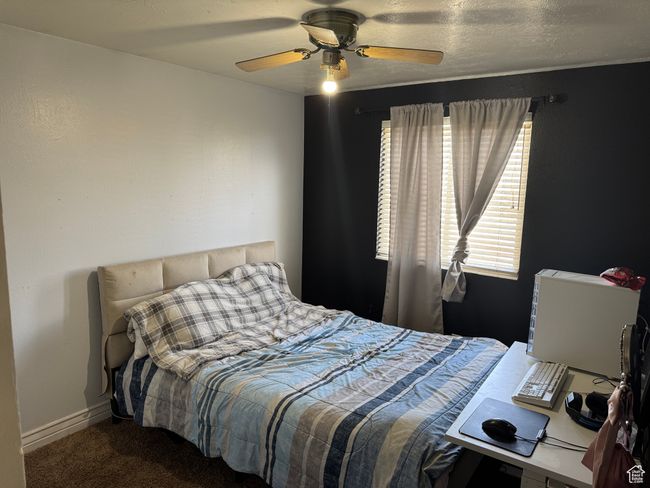 Carpeted bedroom featuring a ceiling fan | Image 8
