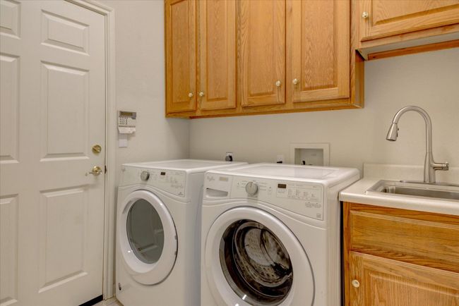 Washroom with cabinet space. | Image 26