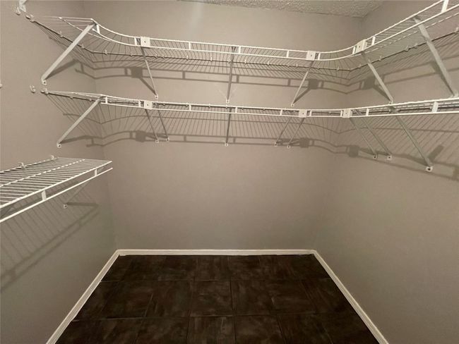 View of walk in closet | Image 8