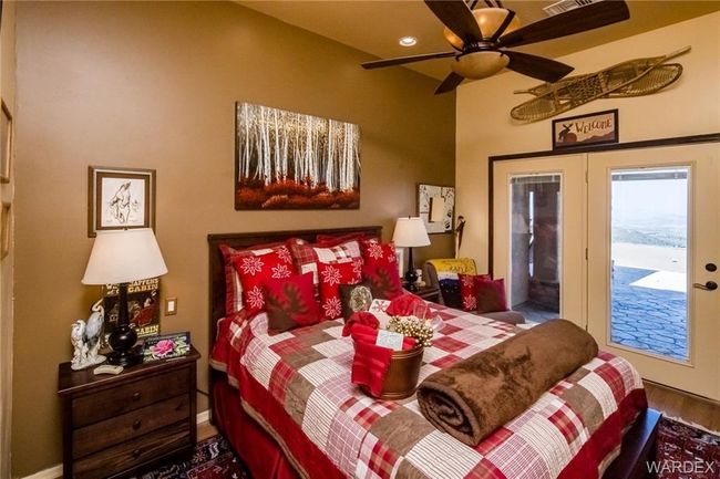 Bedroom featuring access to exterior, wood finished floors, and recessed lighting | Image 63