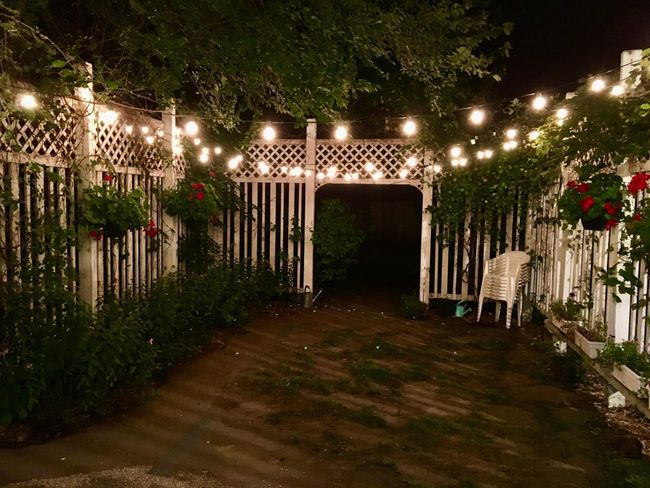 The patio, lit up for an evening of hosting in the summer. | Image 21