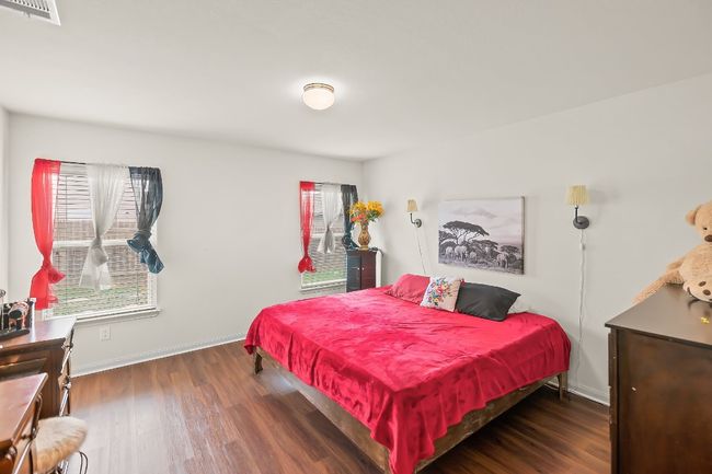 Bedroom featuring dark hardwood / wood-style flooring | Image 12