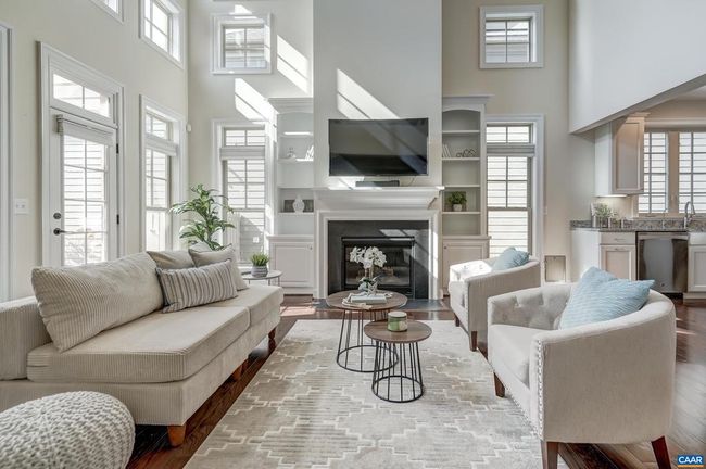 Soaring great room with gas fireplace and built-ins. | Image 14