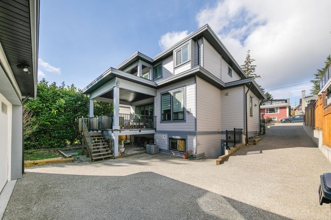 View of front facade with a patio area, stairs, and cooling unit | Image 38
