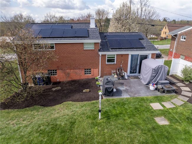 Great brick home, solar panels, patio and a fantastic yard. | Image 22