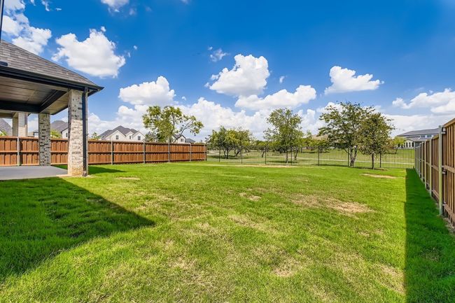 Fenced backyard featuring a patio area | Image 27