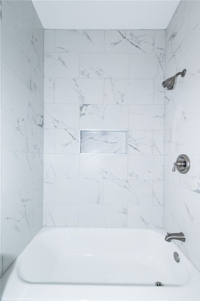 Closeup of secondary bathroom bathtub/shower combo | Image 23