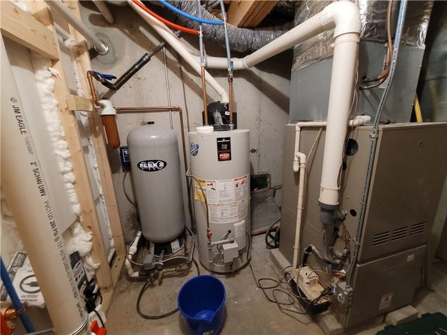Utility room with gas water heater | Image 24