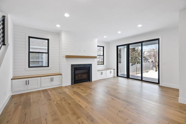 Light a bright living room with plenty of windows for natural light. Pictures of previously built house. | Image 12