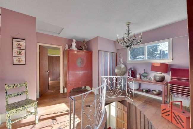 Dining room featuring hardwood / wood-style floors and a chandelier | Image 26