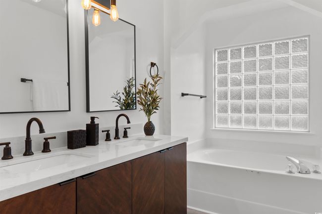 Spare room with ceiling fan, lofted ceiling, light wood-style flooring, and baseboards | Image 14