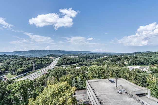 The balcony's elevation allows you to truly appreciate the mountains in the distance and their natural beauty. Soak in the beauty of Chattanooga and the Tennessee hills every day. | Image 18