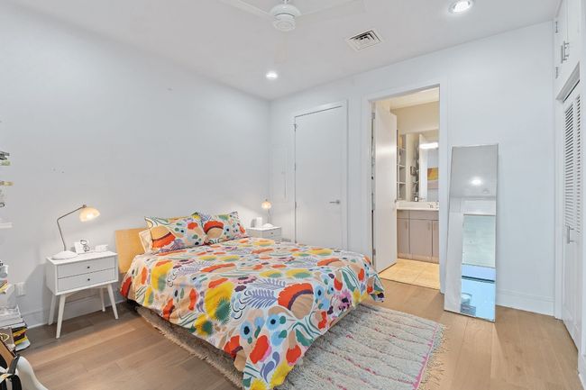 Owner's retreat is spacious and offers two closets with professional closet systems. | Image 19
