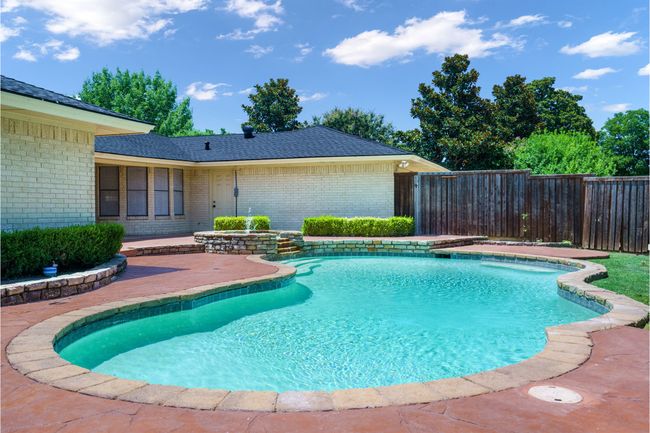 View of pool with a patio | Image 30