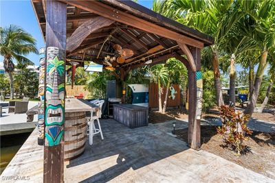 View of patio / terrace featuring a gazebo and an outdoor bar | Image 2