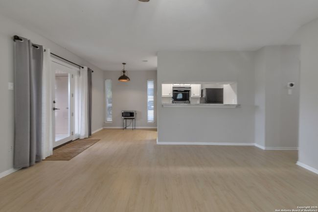 Living room opens to kitchen and dining room | Image 14