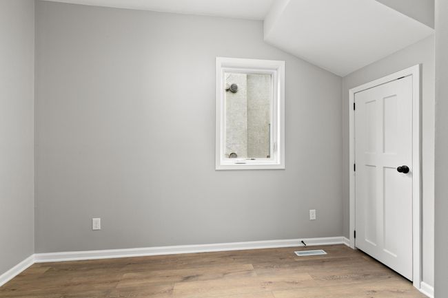 The main level features one bedroom or would make a great home office. | Image 16