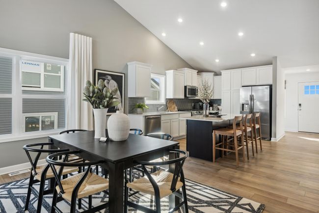 *Photo of model home, actual features may vary. Enjoy plenty of seating at the kitchen island and dining area adjacent to the kitchen. | Image 4