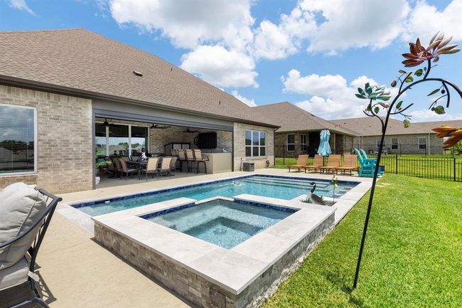 Relax poolside with stunning views of Lake Conroe. | Image 42