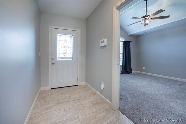 Foyer entryway door with view to guest bedroom | Image 49