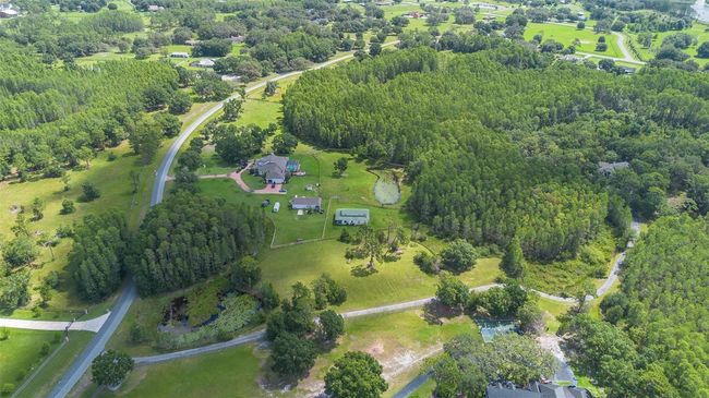 11933 Pasco Trails Blvd, House other with 4 bedrooms, 3 bathrooms and null parking in SPRING HILL FL | Image 60