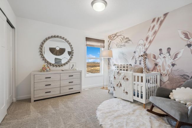 *Photo of model home, actual features may vary. Each of the home's secondary bedrooms on the upper level come perfectly sized and feature a spacious closet. | Image 12