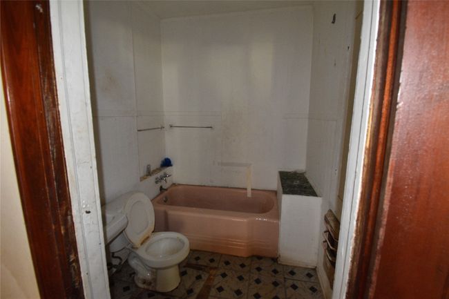 Full bath with a bathtub and tile patterned floors | Image 11