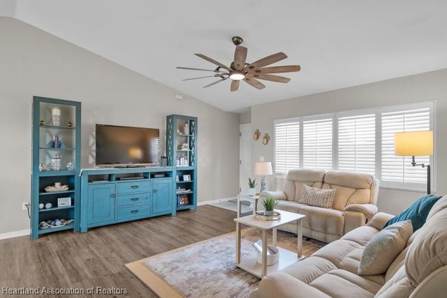 Living room w/plantation shutters | Image 11