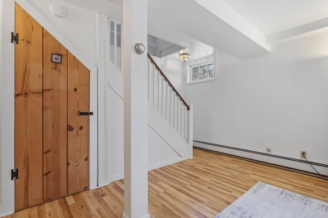 Stairs to lower level with under stair storage closet | Image 18