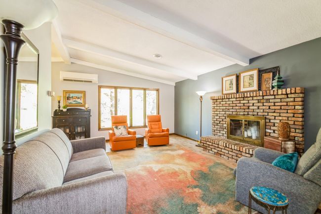 The upper level fireplace is currently used as a decorative fireplace. There is a gas line ran if a buyer would want to add a gas fireplace in the future! | Image 12