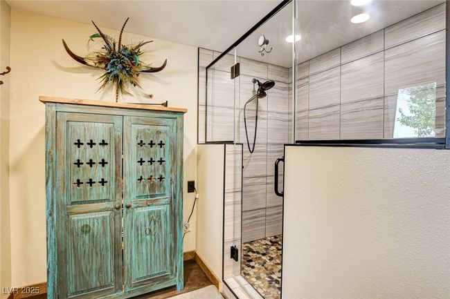 Full bath featuring a shower stall and baseboards | Image 29