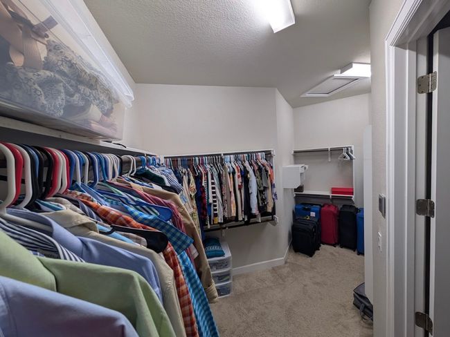 Spacious closet featuring carpet and attic access | Image 14
