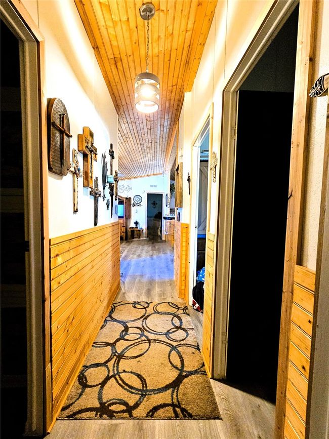 Hall with wood finished floors and wood ceiling | Image 17